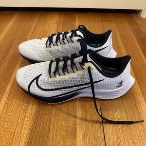 Nike White and Black Athletic Shoes with Sleek Design